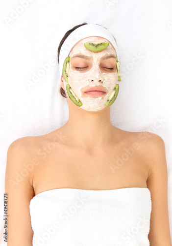 Young woman with clay facial mask