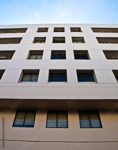 Facade windows of office building on blue sky