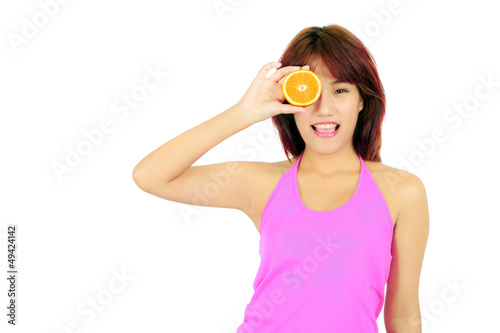 Isolated young asian woman with pieces of orange