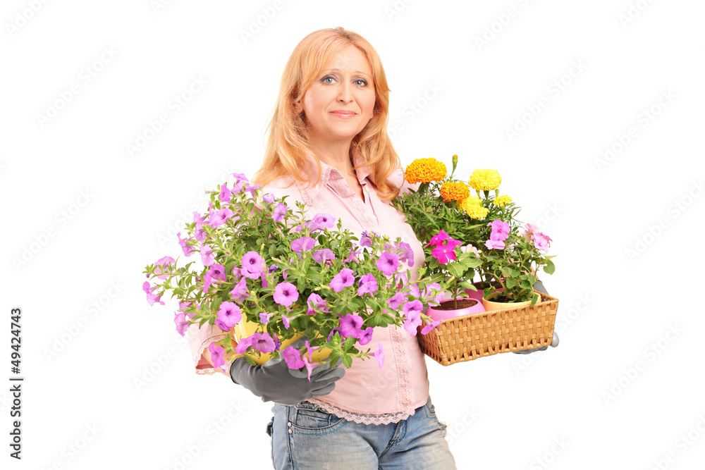 A smiling mature woman holding flowers