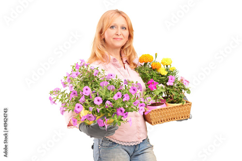A smiling mature woman holding flowers