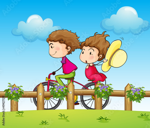 A couple riding a bicycle