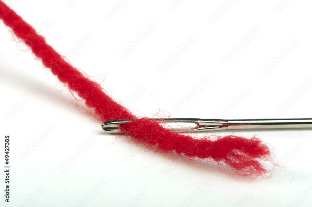 Sewing needle and red thread Sewing needle and red thread