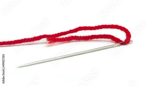Sewing needle and red thread