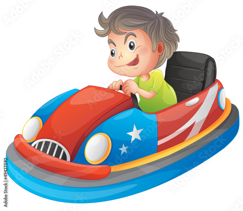 A young boy riding a bumper car