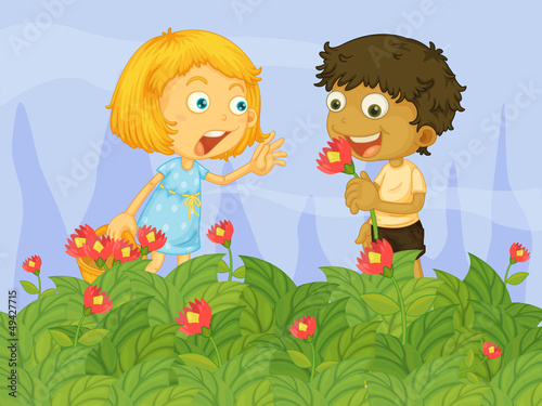 Kids picking up flowers in the garden