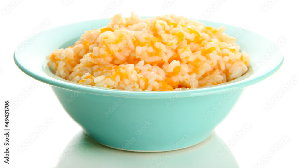 Taste rice porridge with pumpkin in blue bowl, isolated Taste rice porridge with pumpkin in blue bowl, isolated