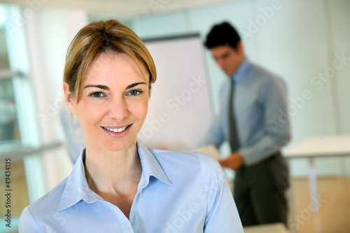 Cheerful businesswoman attending seminar