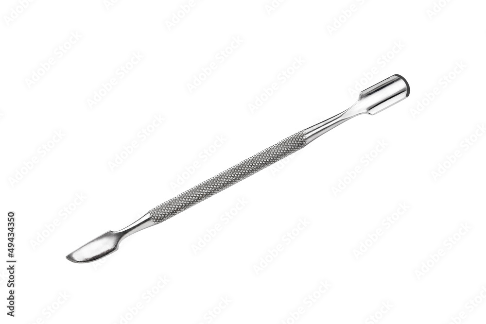 Metal manicure and pedicure cuticle pusher isolated on white