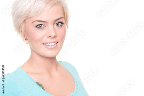 Young and smiling woman in front of white background