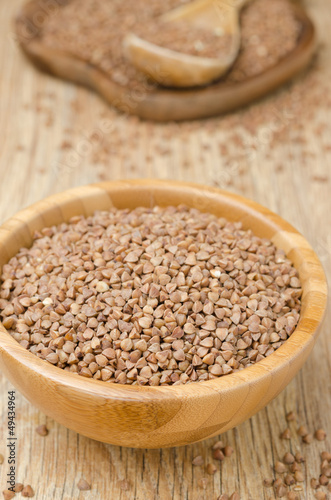 Buckwheat in a wooden bowl top view