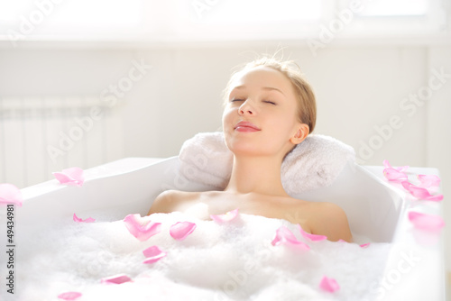 An Attractive girl relaxing in bath