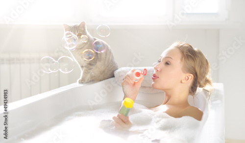 An Attractive girl relaxing in bath