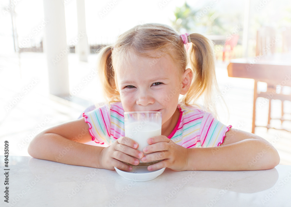 child with a glass of milk child with a glass of milk