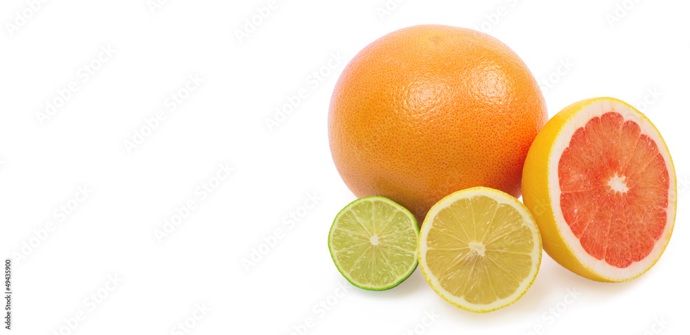 Fototapeta premium Image of a fresh whole lime, lemon and orange isolated on white