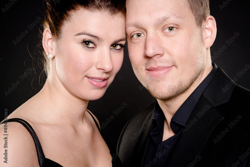 Young and happy couple in front of white background Young and happy couple in front of white background