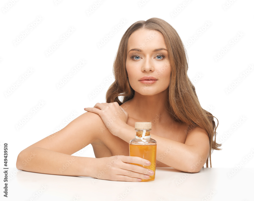 Fototapeta premium woman with oil bottle