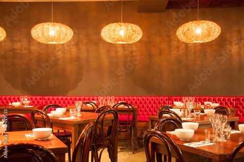 interior of modern restaurant , empty glass on table.