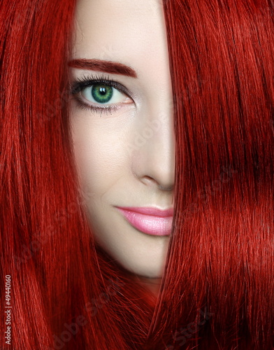 Beauty woman with red bright hair. Closeup portrait of style fem