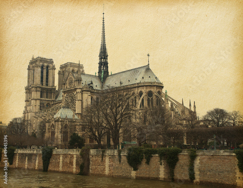 Notre Dame de Paris. Photo in retro style. Paper texture.