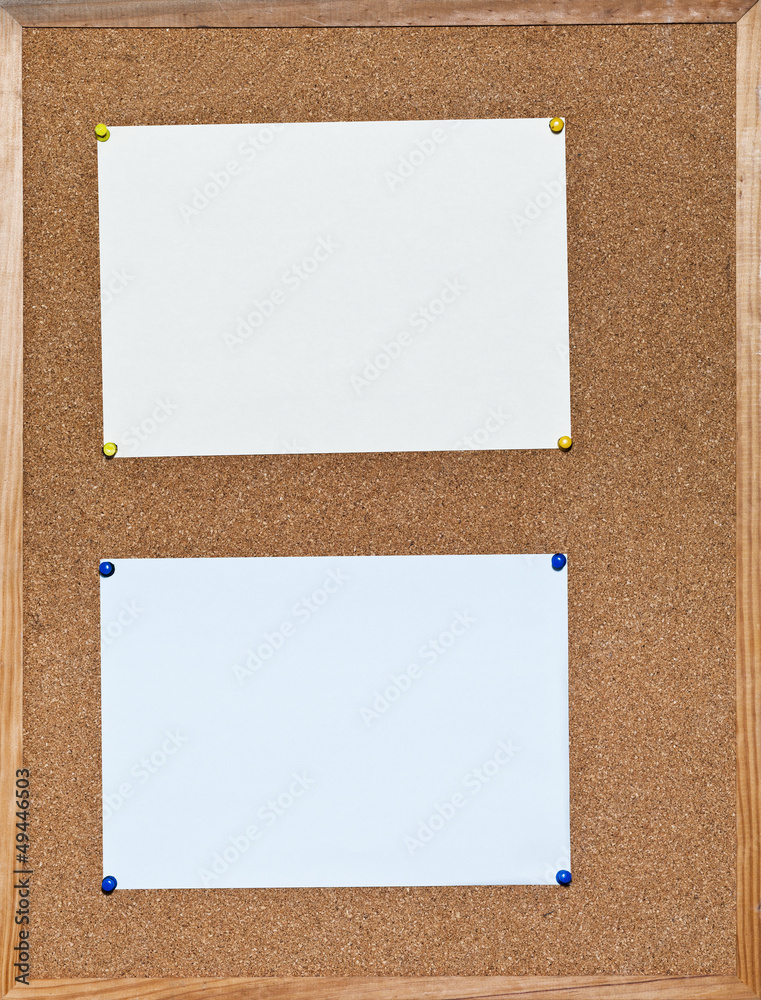 Fototapeta premium two sheets of paper on cork board