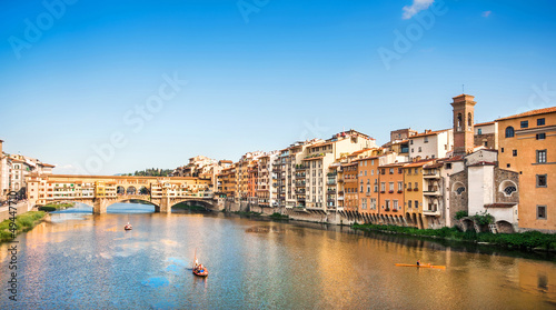 Ponte Vecchio with river Arno at sunset in Florence, Italy