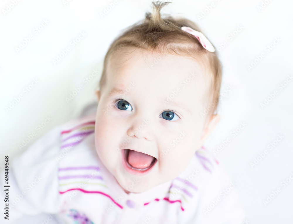 Beautiful baby girl on a white background