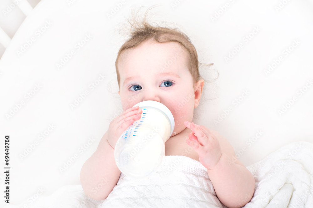 Little baby drinking milk from a bottle Little baby drinking milk from a bottle
