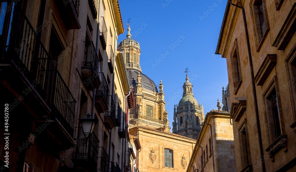 Skyline of Salamanca from a dark alley