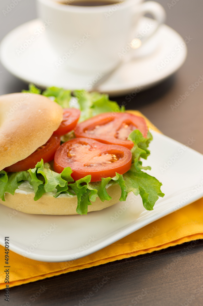 Bagel with tomato and lettuce