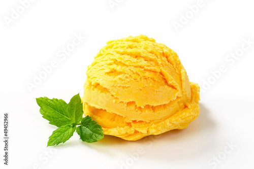 Scoop of yellow ice cream photo