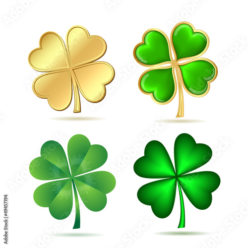 Set of four-leaf clovers isolated on white.