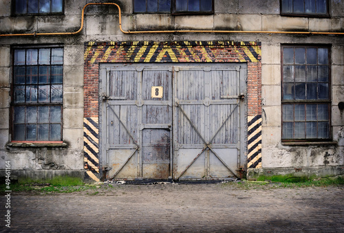 Abandoned old factory with closed door and windows