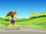 A girl running in the street near the hills
