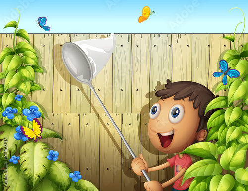 A butterfly catcher inside a yard with fence