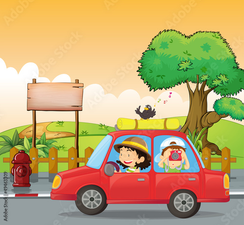 A girl driving and a boy taking pictures