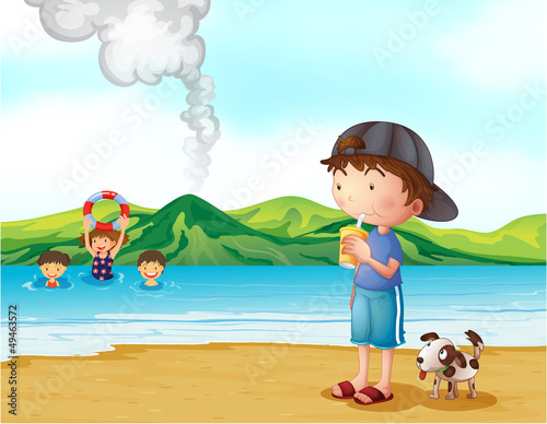 Kids swimming and a boy and his pet at the seashore