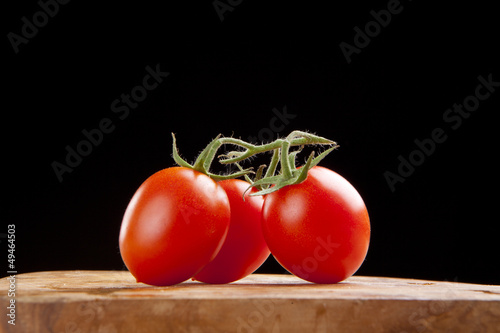 fresh ripe cherry tomato on wooden table