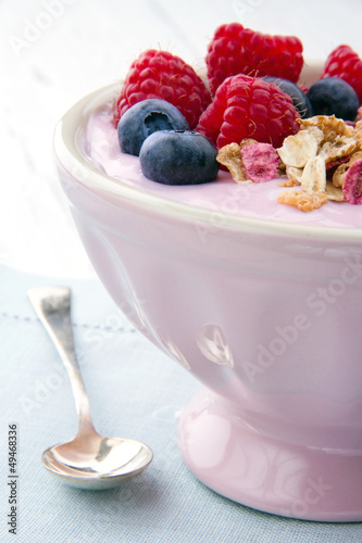 Blueberries, raspberries and yoghurt with muesli photo