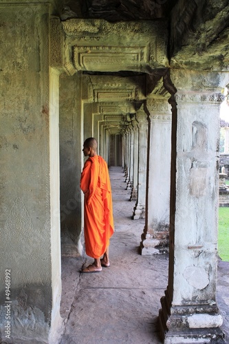 Monk among the ruins at Angkor Wat, Cambodia © John