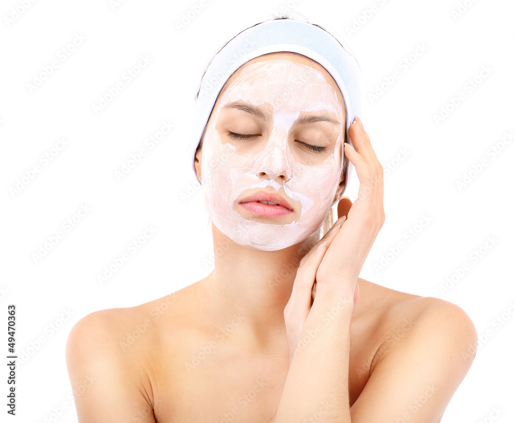 Young woman with clay facial mask, isolated on white Young woman with clay facial mask, isolated on white