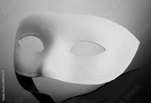 White mask, on grey background