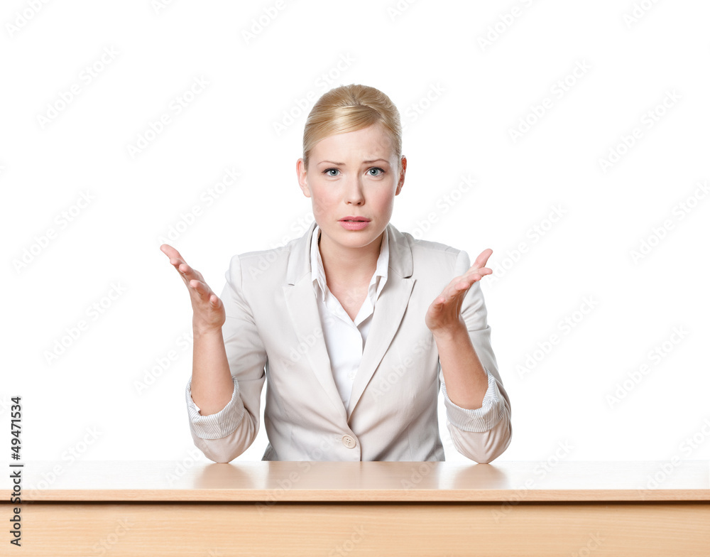 Young businesswoman sitting at a office table, isolated Young businesswoman sitting at a office table, isolated