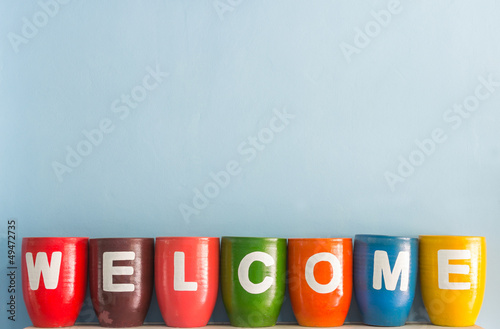 Welcome word on vase background blue sky wall