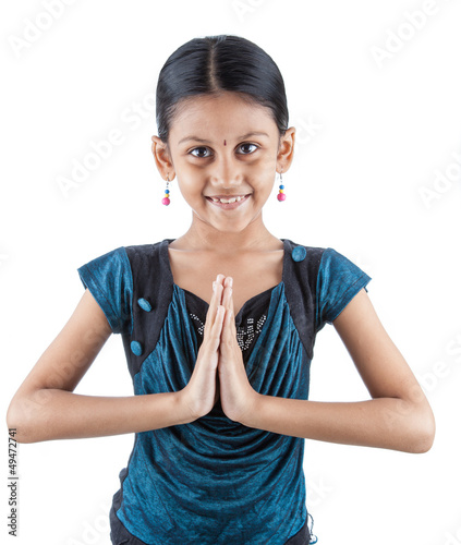 Traditional Indian girl holding hands in prayer position