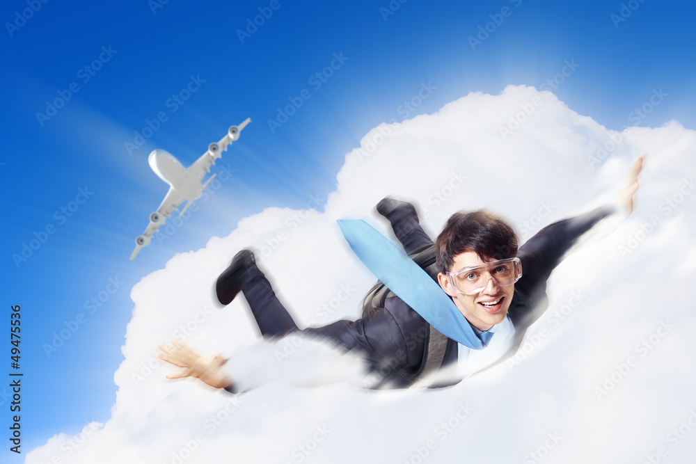 Young businessman flying with parachute on back Young businessman flying with parachute on back
