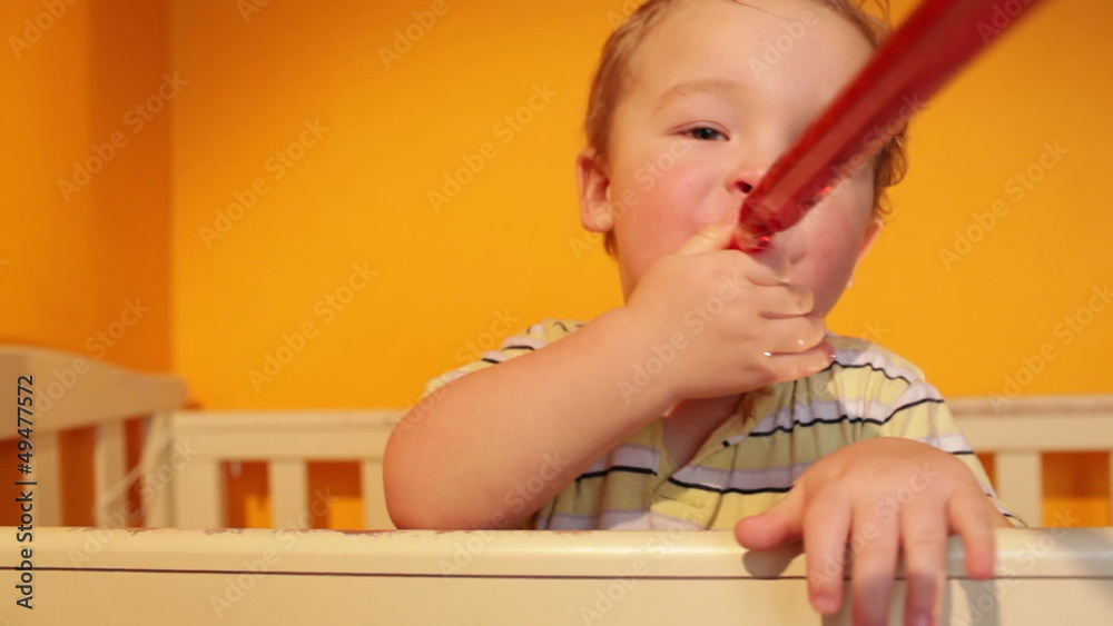 Portrait of the boy playing in playpen. Portrait of the boy playing in playpen.