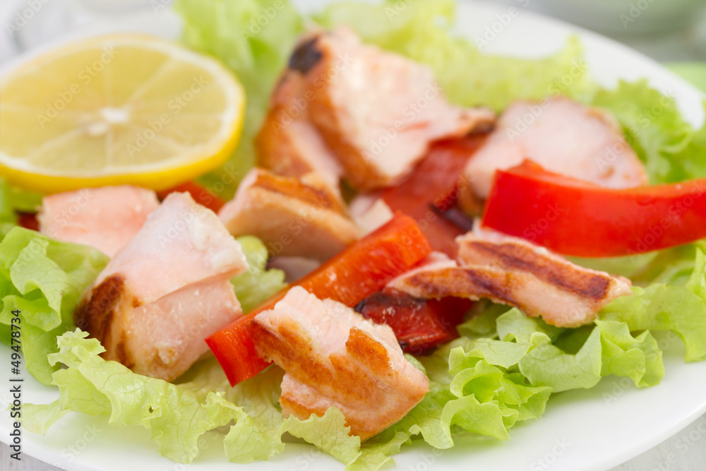 salad with salmon, pepper and lemon