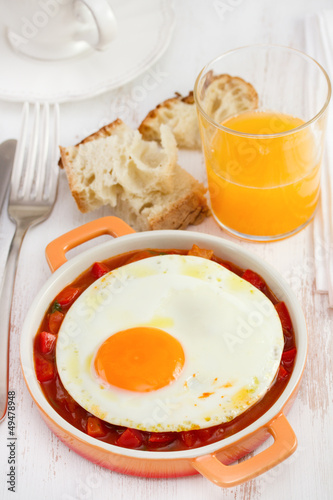 fried egg with vegetables and orange juice