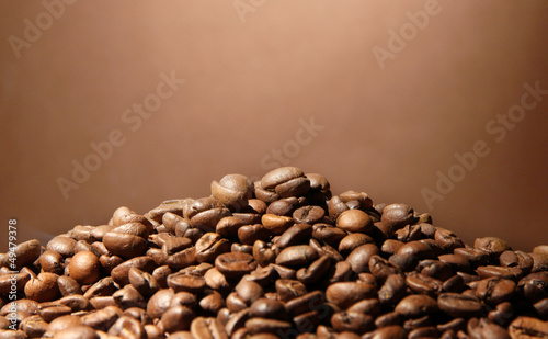 coffee beans on brown background © Africa Studio